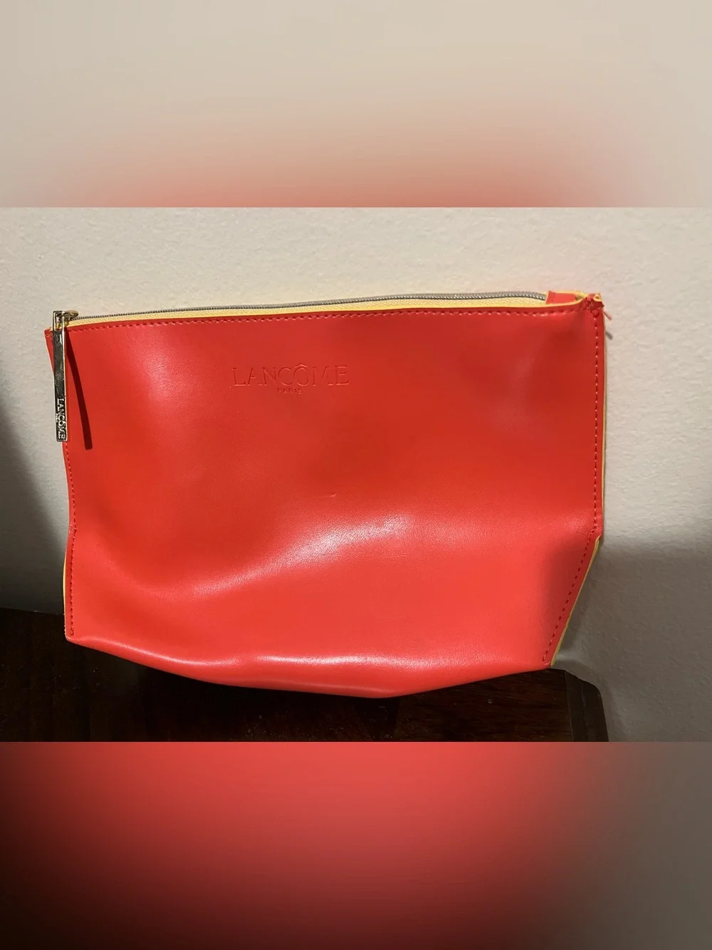 Orange Lancôme Cosmetic Pouch with Yellow Detailing